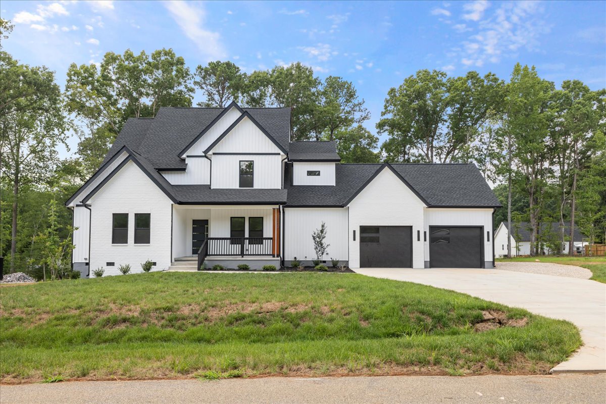Exterior view of a completed project by FEP Construction with a natural wooded backyard in North Carolina.